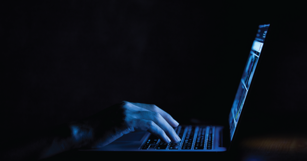 hands typing on keyboard